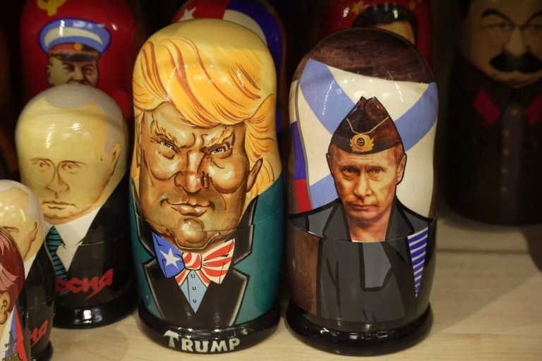 Traditional Russian wooden dolls called Matryoshka depicting Russian President Vladimir Putin, right, and President Donald Trump are displayed for sale among others at a souvenir shop in St. Petersburg, Russia, Tuesday, March 18, 2025.