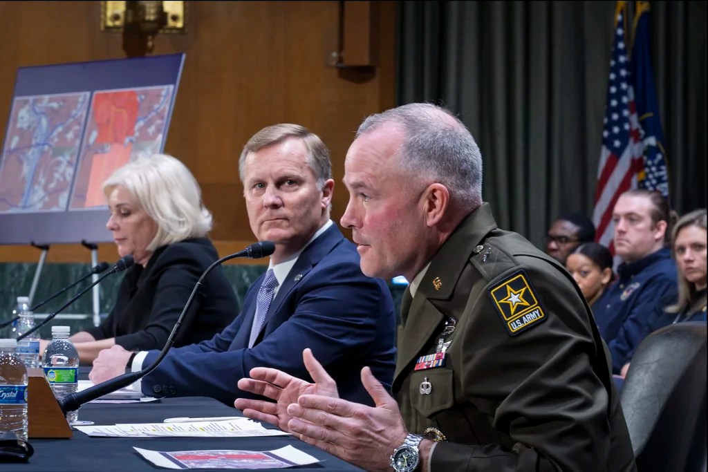 Brig. Gen. Matthew Braman, director of Army Aviation, center, answers questions, joined from left by Jennifer Homendy, chair of the National Transportation Safety Board, and Chris Rocheleau, acting administrator of the Federal Aviation Administration, as the Senate Transportation Subcommittee holds a hearing to examine the preliminary report by the National Transportation Safety Board on the Jan. 29, 2025, midair collision of an Army Black Hawk helicopter and an American Airlines regional jet, on Capitol Hill in Washington, Thursday, March 27, 2025.