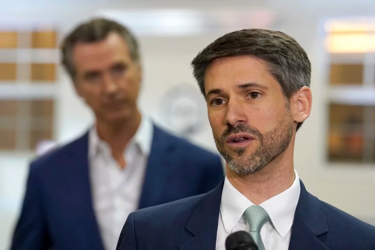 San Jose Mayor Matt Mahan, right, discusses California Gov. Gavin Newsom's, left, proposal to build 1,200 small homes across the state to reduce homelessness, during the first of a four-day tour of the state in Sacramento Calif., on Thursday, March 16, 2023. In lieu of a traditional State of the State the Democratic governor, who just began his second term, has planned four days of policy speeches around the state.