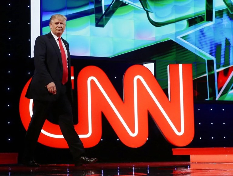 Republican presidential candidate, businessman Donald Trump enters the debate hall during the Republican presidential debate sponsored by CNN, Salem Media Group and the Washington Times at the University of Miami, Thursday, March 10, 2016, in Coral Gables, Fla. (AP Photo/Alan Diaz)
