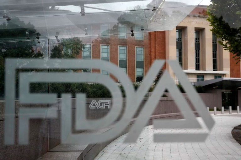 FILE - The U.S. Food and Drug Administration building behind FDA logos at a bus stop on the agency's campus in Silver Spring, Md, Thursday, Aug. 2, 2018.