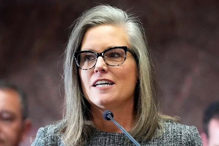 Gov. Katie Hobbs (D-AZ) delivers her state of the state address at the Arizona Capitol in Phoenix on Jan. 9, 2023. Joshua Russell, of Bucyrus, Ohio, was sentenced Monday, March 25, 2024, in federal court in Phoenix, to two and a half years in prison for his conviction for making an interstate threat against then-Arizona Secretary of State Katie Hobbs during the 2022 campaign season. Russell Had acknowledged making death threats in three voicemails left for Hobbs, who at the time was Arizona's chief election officer and now serves as Arizona's governor.