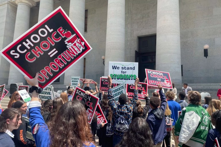 Students and parents rally at the Ohio Statehouse.