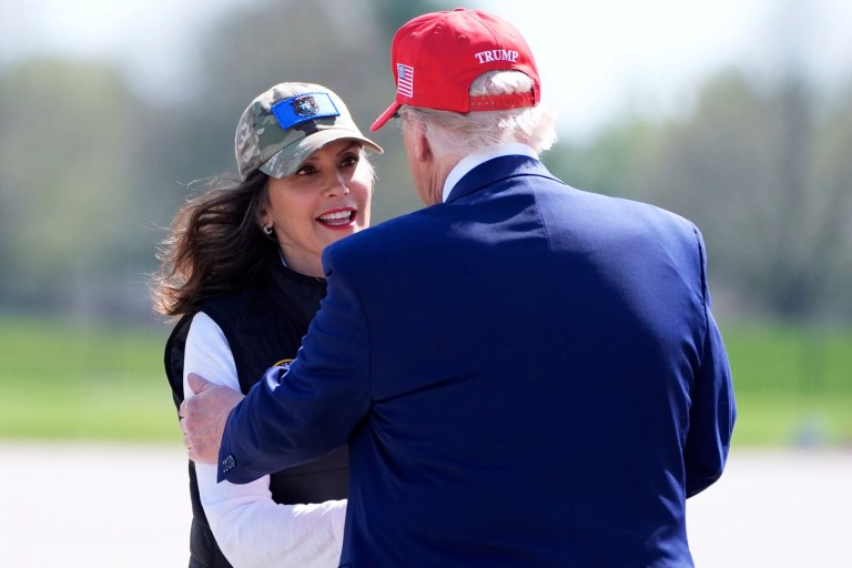 President Donald Trump listens as Gov. Gretchen Whitmer (D-MI) speaks to members of the Michigan National Guard at Selfridge Air National Guard Base, Tuesday, April 29, 2025, in Harrison Township, Michigan.