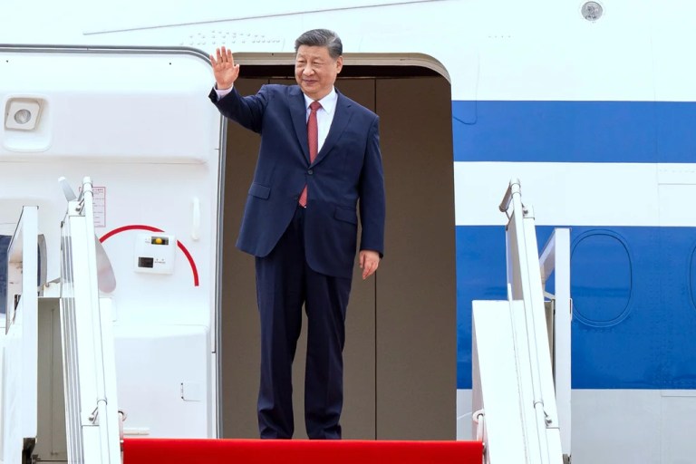 Chinese President Xi Jingping waves from a plane during a send-off ceremony at Phnom Penh International Airport in Phnom Penh, Cambodia, Friday, April 18, 2025.