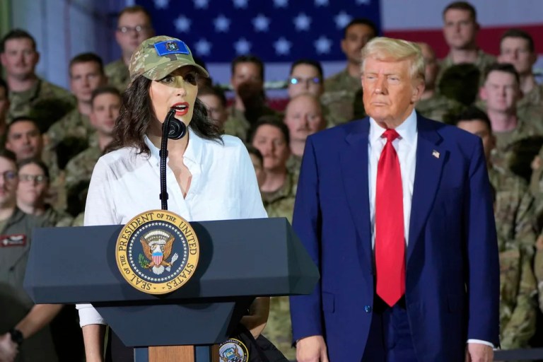 President Donald Trump listens as Gov. Gretchen Whitmer (D-MI) speaks to members of the Michigan National Guard.