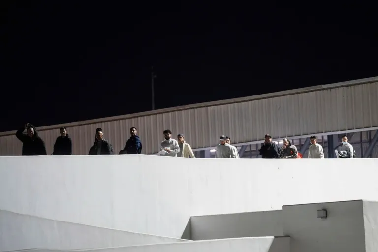 Migrants walk into Mexico after being deported from the United States at El Chaparral pedestrian border bridge in Tijuana, Mexico, Jan. 21, 2025.