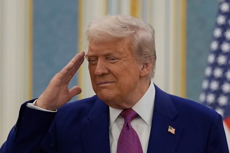 President Donald Trump salutes as he greets with Saudi Crown Prince Mohammed bin Salman delegations at the Royal Palace in Riyadh, Saudi Arabia