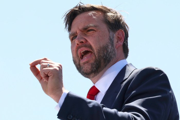 Vice President JD Vance displays a U.S. Naval Academy jacket he received during the U.S. Naval Academy's graduation and commissioning ceremony, at the U.S. Naval Academy in Annapolis, Md., Friday, May 23, 2025. (AP Photo/Stephanie Scarbrough)