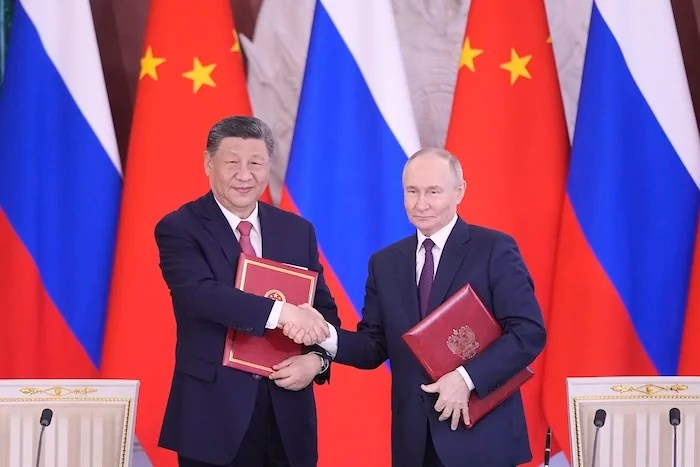 Vladimir Putin and Xi Jinping at meeting in Moscow.