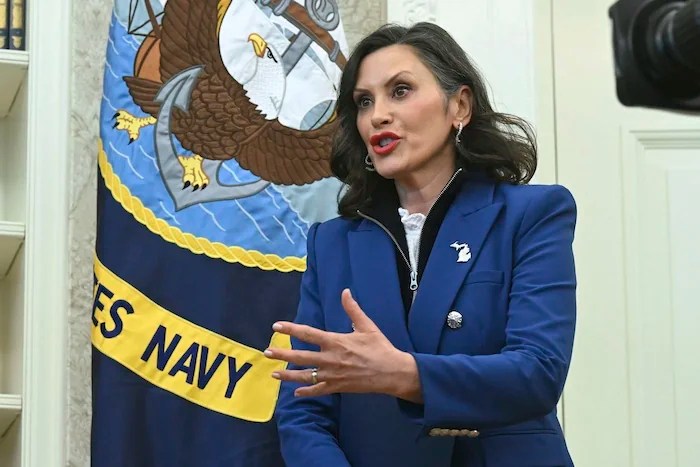 Gov. Gretchen Whitmer (D-MI) gestures as she speaks in the Oval Office.