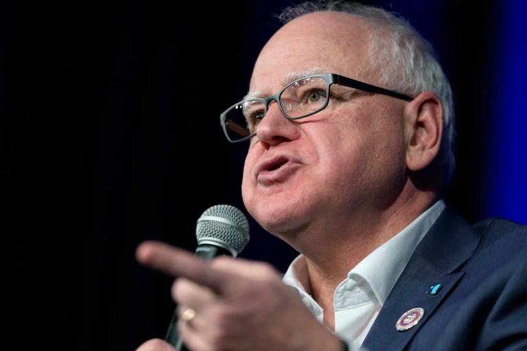 FILE - Minnesota Gov. Tim Walz speaks at a town hall event at Roosevelt High School, Friday, March 14, 2025, in Des Moines, Iowa. (AP Photo/Matthew Putney,File)