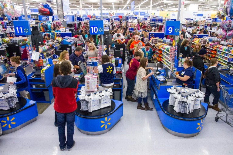 IMAGE DISTRIBUTED FOR WALMART - Customers wrap up their holiday shopping during Walmart's Black Friday events on Thursday, Nov. 27, 2014 in Bentonville, Ark. Deep savings continue at Walmart Friday though Cyber Monday as part of five days of events in stores and online. (Photo by Gunnar Rathbun/Invision for Walmart/AP Images)