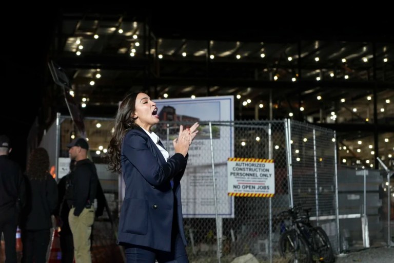 Rep. Alexandria Ocasio-Cortez (D-NY) greets supporters of former Vice President Kamala Harris outside a Puerto Rican restaurant that Harris visited in Reading, Pennsylvania, Monday, Nov. 4, 2024.