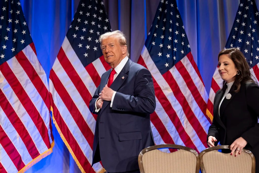President-elect Donald Trump arrives to speak at a meeting of the House GOP conference, followed by Rep. Elise Stefanik, R-N.Y.