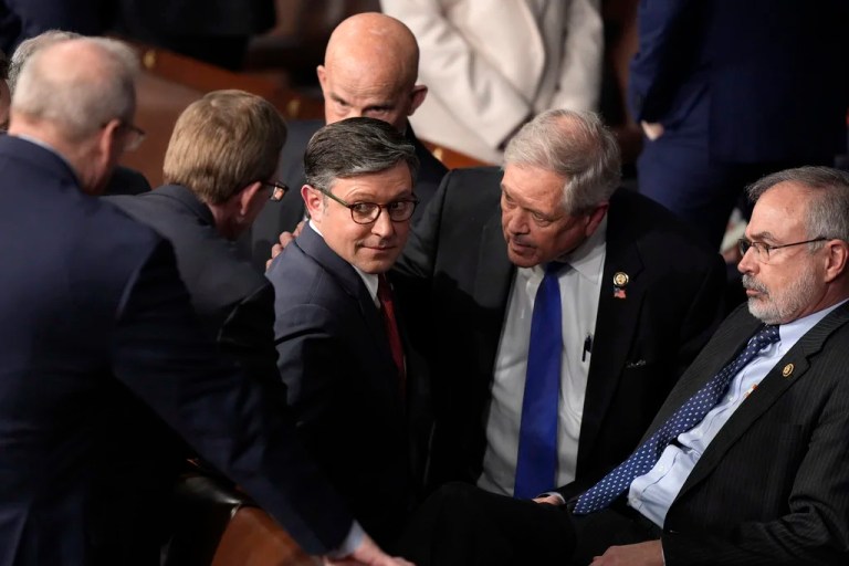 House Speaker Mike Johnson (R-LA) speaks with Rep. Andy Harris (R-MD) and other members.