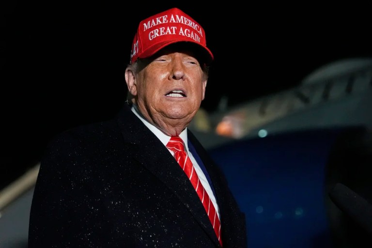 President Donald Trump speaks to reporters in the rain after arriving on Air Force One at Joint Base Andrews, Md., Friday, May 30, 2025.