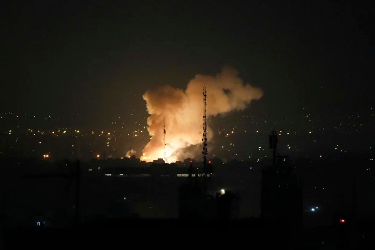Smoke rises up after an explosion in Tehran, Iran, Friday, June 13, 2025.