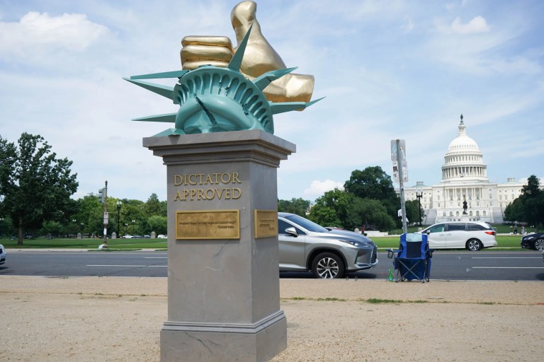The statue, placed at the same location as the 'poop statue' in 2024, was crowded by tourists taking their own pictures.