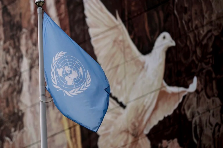 The flag of the International Atomic Energy Agency waves near a mural in Vienna, Austria, Monday, June 23, 2025. (AP Photo/Michael Gruber)