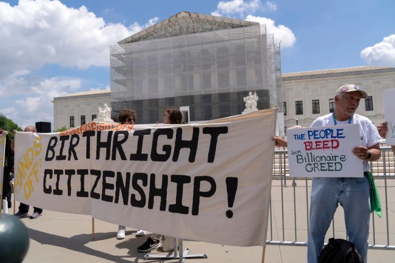 Demonstrators holds up a banner during a citizenship rally outside of the Supreme Court in Washington, Thursday, May 15, 2025.