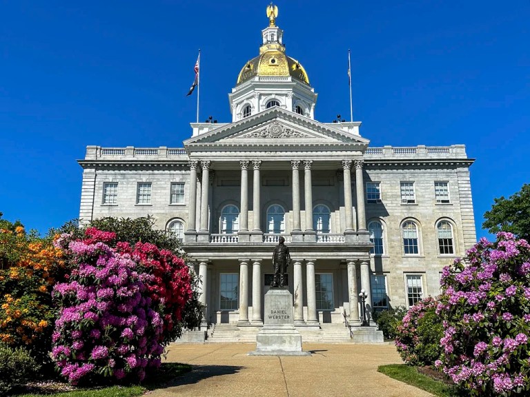 FILE - Flowers bloom outside the New Hampshire Statehouse on June 1, 2024, in Concord, N.H. (AP Photo/Holly Ramer, file)