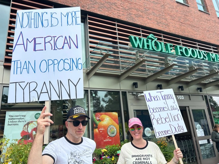 Two protestors attend the 
