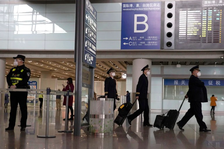 China blocks two Americans from leaving country