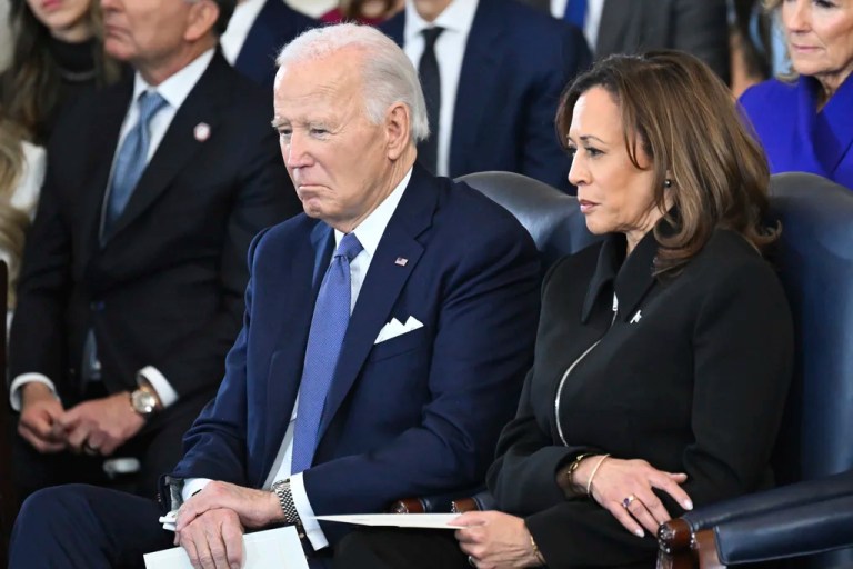 President Joe Biden sits next to Vice President Kamala Harris.