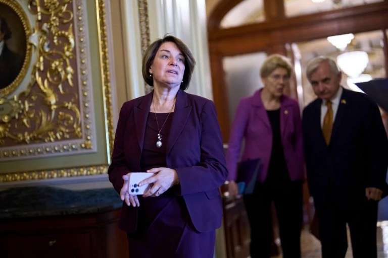 Sen. Amy Klobuchar (D-MN) pauses as senators arrive for votes and policy meetings at the Capitol.