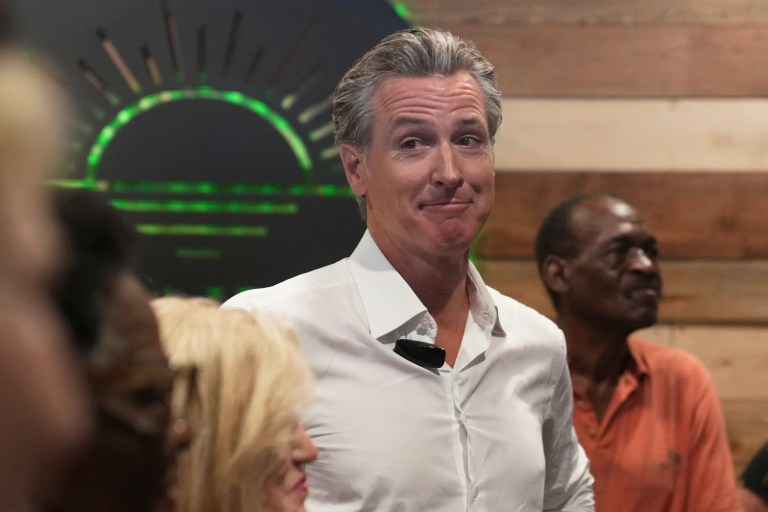 Gov. Gavin Newsom (D-CA) waits to speak to a crowd at a coffee shop during a two-day swing through South Carolina, Tuesday, July 8, 2025, in Mullins, South Carolina.