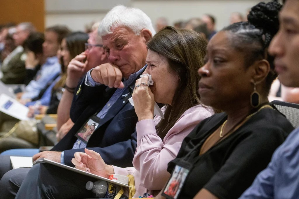 Three family members of the victims of the deadly American Airlines crash in Washington seen crying during a hearing on the incident.