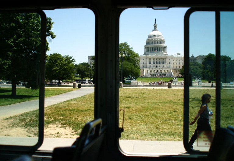 **ADVANCE FOR FRIDAY, JULY 4** The U.S. Capitol Building is viewed through the windows of a tour bus in Washington, D.C., May 29, 2008. Washington's tourist sites offer insight into how Americans view themselves and their nation.