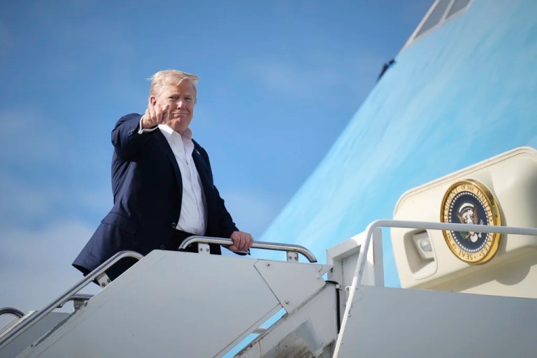 President Donald Trump points at the press as he departs Scotland on July 29, 2025.