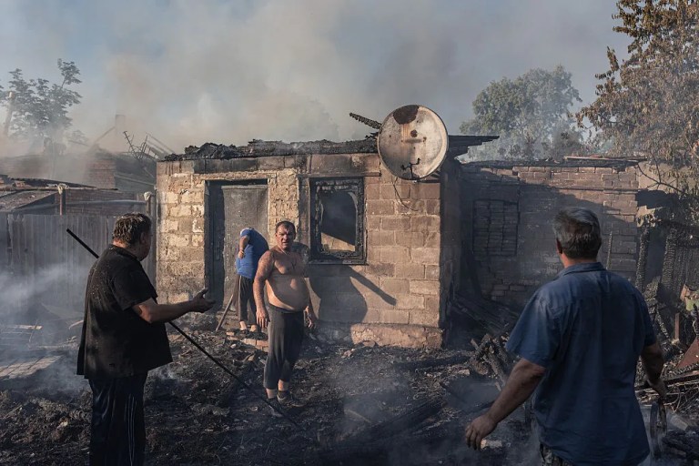Ukrainian civilians try to extinguish a house fire after Russian shelling on the city of Kostiantynivka, Ukraine, 16 July 2025. (Photo by Diego Herrera Carcedo/Anadolu via Getty Images)