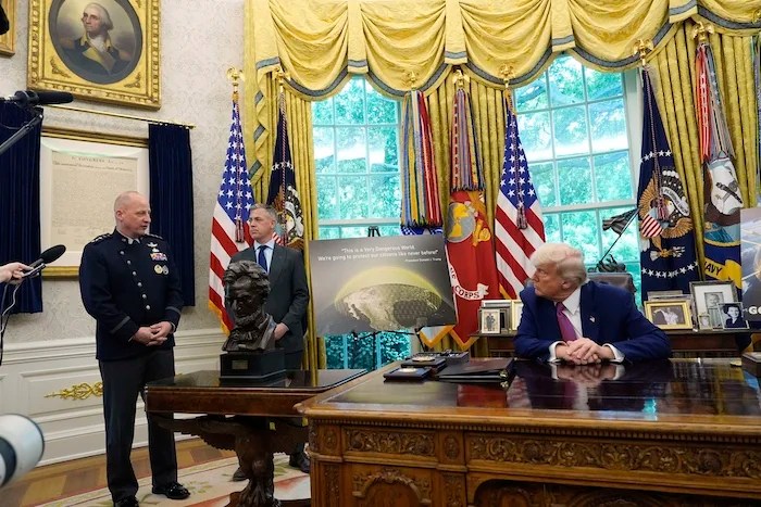 President Donald Trump, Rep. Jim Banks (R-IN), and Space Force vice chief of space operations Gen. Michael Guetlein.