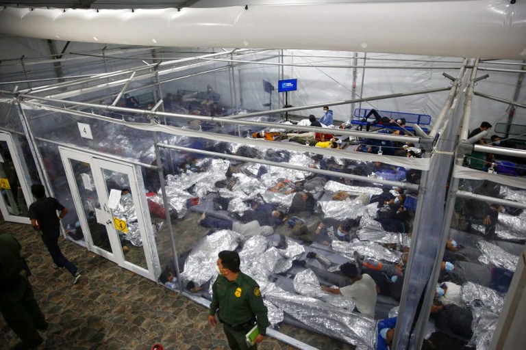 In this March 30, 2021, file photo, minors inside a pod at the Donna Department of Homeland Security holding facility, the main detention center for unaccompanied children in the Rio Grande Valley run by Customs and Border Protection, in Donna, Texas. More Americans disapprove than approve  of how President Joe Biden is handling waves of unaccompanied immigrant children arriving at the U.S.-Mexico border, and his efforts on larger immigration policy aren’t polling as well as those on other top issues.