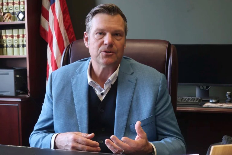 Kansas Attorney General Kris Kobach speaks during an interview with The Associated Press, Dec. 18, 2024, in his office in Topeka, Kan.