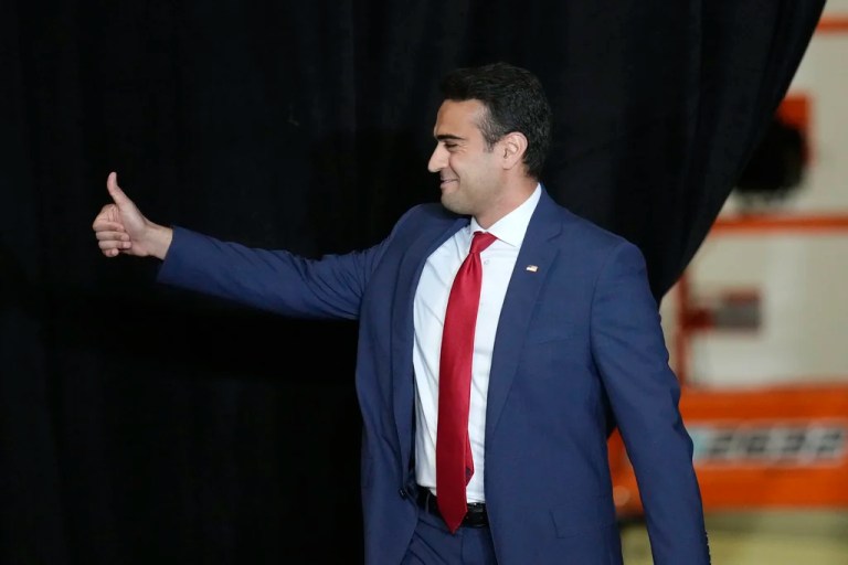 Arizona Republican candidate for the 8th Congressional District Abe Hamadeh waves to supporters as he arrives on stage to speak during a campaign event Tuesday, Oct. 22, 2024, in Peoria, Ariz. (AP Photo/Ross D. Franklin)