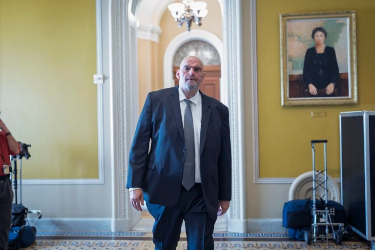Sen. John Fetterman (D-PA) arrives at the chamber as senators gather for a group photo, at the Capitol in Washington, Tuesday, July 15, 2025.