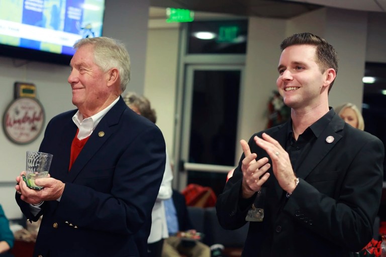Pittsylvania County Board of Supervisors member Kenneth Bowman, left, and Danville councilman Lee Vogler attend the Danville Community College Education Foundation Holiday Gathering in Danville, Virginia, Dec. 2024.