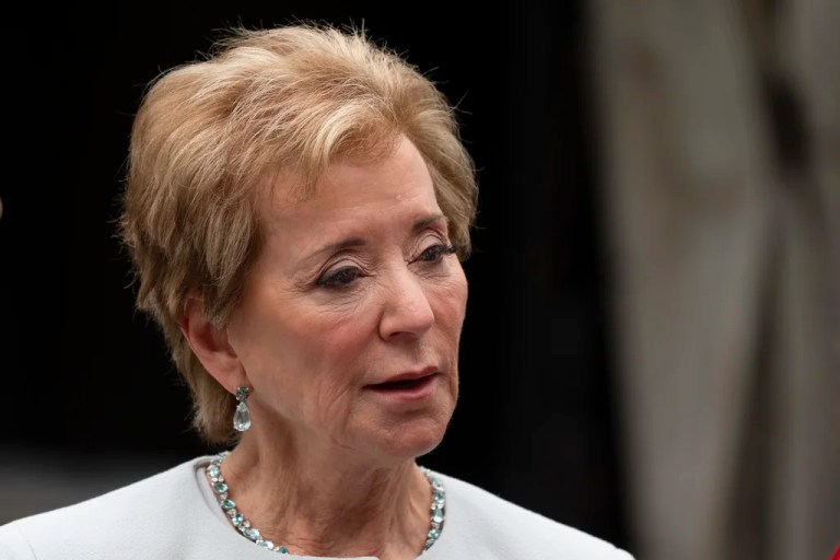 Education Secretary Linda McMahon talks to her staff as they wait on the North Lawn of the White House.