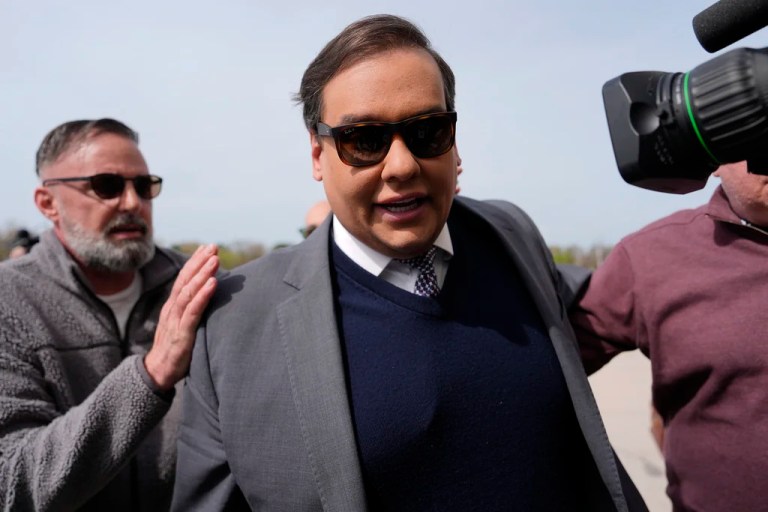George Santos reports to prison after pleading for pardon and suggesting he’ll die there