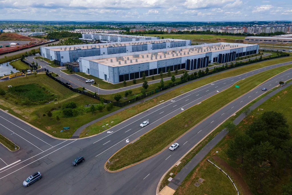 Data centers are in Ashburn in Loudon County, Virginia, on Sunday, July 16, 2023. The centers house the computer servers and hardware required to support modern internet use, including artificial intelligence. The county is home to the world's largest concentration of data centers. Tech companies like to place the centers here, partly because the region's proximity to the nation's traditional internet backbone allows the servers in those data centers to save nanoseconds crucial to support financial transactions, gaming technology and other time-sensitive applications.