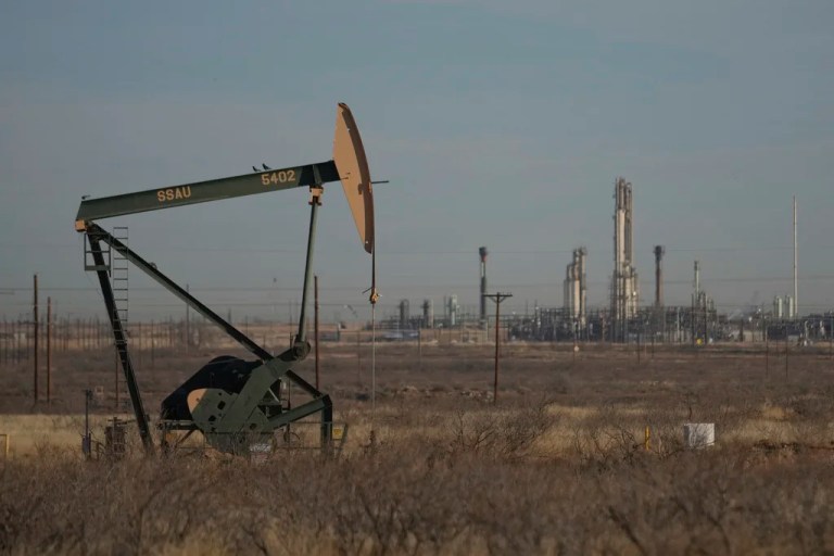 A pumpjack is visible on a field.
