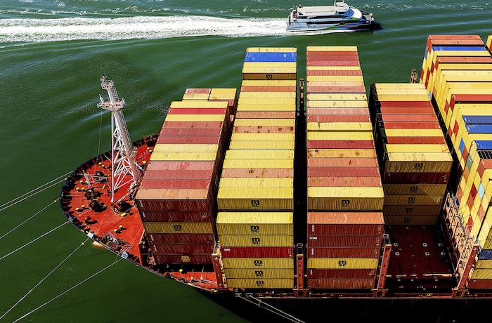 Cargo containers fill a ship at the Port of Oakland on Wednesday
