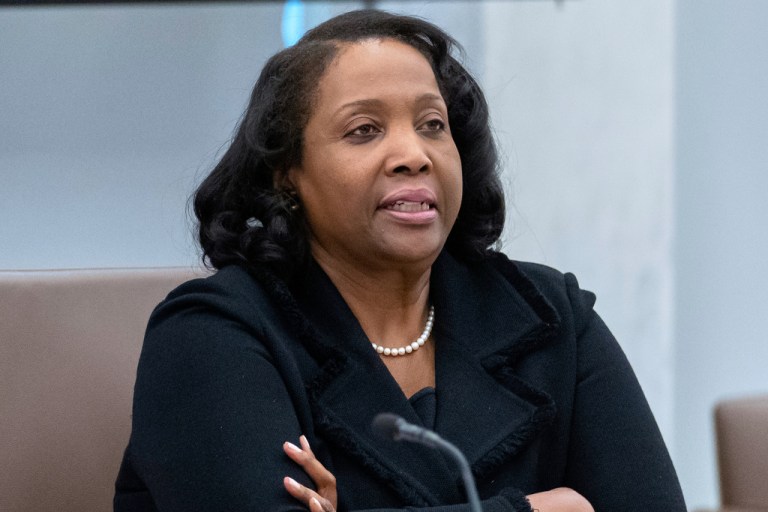 Federal Reserve Board of Governors member Lisa Cook listens during an open meeting of the Board of Governors at the Federal Reserve.