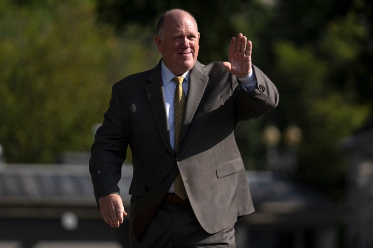 White House border czar Tom Homan waves to reporters outside the White House.