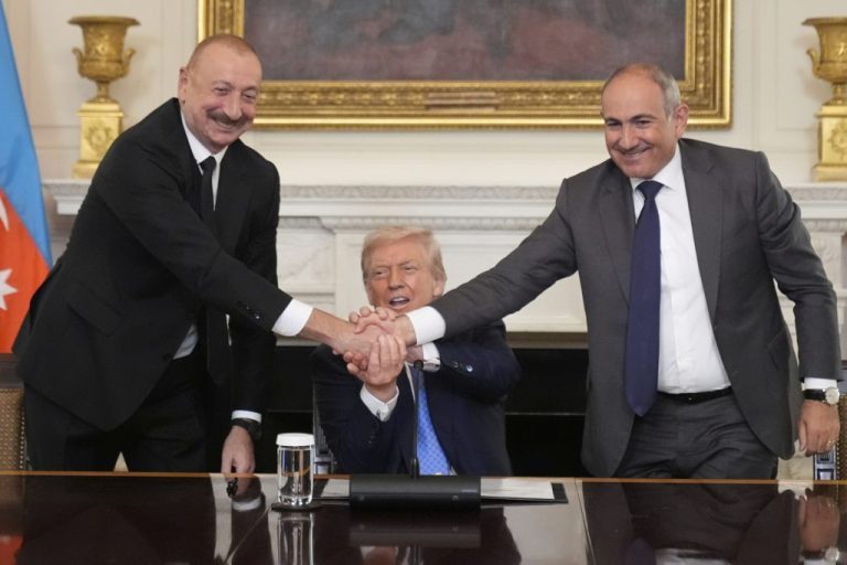President Donald Trump shakes hands with Armenian Prime Minister Nikol Pashinyan (right) and Azerbaijan President Ilham Aliyev (left).