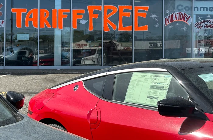 A dealership in Totowa, New Jersey tries to attract vehicle shoppers. (AP Photo/Ted Shaffrey)